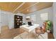 Home office with wood ceiling, vinyl flooring, desk, and ample natural light at 317 Compton Rd, Raleigh, NC 27609