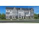 Three-story townhouses with gray siding and white trim at 522 Billingshurst Way, Knightdale, NC 27545