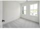 Bright bedroom with neutral carpet, two windows, and ample natural light at 524 Billingshurst Way, Knightdale, NC 27545