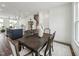 Formal dining room adjacent to kitchen with dark wood table and seating for six at 524 Billingshurst Way, Knightdale, NC 27545