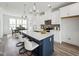 Bright modern kitchen with white cabinets, large island, and stainless steel appliances at 524 Billingshurst Way, Knightdale, NC 27545
