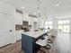Open kitchen with stainless steel appliances, large center island, and seating for four at 524 Billingshurst Way, Knightdale, NC 27545