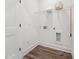 The laundry room features wood floors, wire shelving, and utility connections at 524 Billingshurst Way, Knightdale, NC 27545