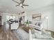 Open-concept living room flows into kitchen with modern decor and plenty of natural light at 524 Billingshurst Way, Knightdale, NC 27545