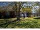 Large backyard with a trampoline and grill at 555 House Rd, Kenly, NC 27542