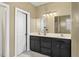 Bathroom with double vanity and dark cabinets at 555 House Rd, Kenly, NC 27542