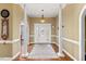 Bright and spacious entryway with hardwood floors and elegant columns at 555 House Rd, Kenly, NC 27542