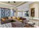 Cozy living room featuring a sectional sofa and large windows at 555 House Rd, Kenly, NC 27542