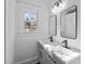 Updated bathroom with double vanity, new fixtures, and large mirrors at 835 Sunset Ave, Rocky Mount, NC 27804
