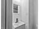 Clean bathroom with a single vanity and mirrored medicine cabinet at 835 Sunset Ave, Rocky Mount, NC 27804