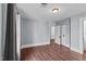Spacious bedroom with hardwood floors and access to another room at 835 Sunset Ave, Rocky Mount, NC 27804