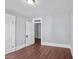Bright bedroom with hardwood floors and gray walls at 835 Sunset Ave, Rocky Mount, NC 27804