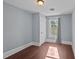 Bright bedroom with hardwood floors and gray walls at 835 Sunset Ave, Rocky Mount, NC 27804