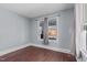 Bright bedroom with hardwood floors and a large window at 835 Sunset Ave, Rocky Mount, NC 27804
