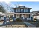 Two-story Craftsman home with gray siding, white trim, and a front porch at 835 Sunset Ave, Rocky Mount, NC 27804
