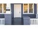 White front door with sidelights and a gray frame at 835 Sunset Ave, Rocky Mount, NC 27804