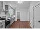 Renovated kitchen features gray cabinets, stainless steel appliances, and new flooring at 835 Sunset Ave, Rocky Mount, NC 27804