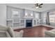 Living room with hardwood floors, fireplace, and built-in shelving at 835 Sunset Ave, Rocky Mount, NC 27804