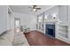 Living room with hardwood floors, fireplace, and built-in shelving at 835 Sunset Ave, Rocky Mount, NC 27804