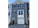 New townhome featuring stone accents, an attached garage, neutral siding, and shuttered windows at 851 Parc Townes Dr # 10, Wendell, NC 27591