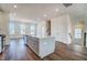 Kitchen island with stainless steel dishwasher looking out to the living area at 851 Parc Townes Dr # 10, Wendell, NC 27591