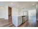 Kitchen island features a stainless steel dishwasher looking out to the stairs at 851 Parc Townes Dr # 10, Wendell, NC 27591
