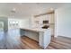 Kitchen with a large island, white cabinets, and stainless steel appliances at 851 Parc Townes Dr # 10, Wendell, NC 27591