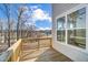 Spacious wooden deck with scenic views of mature trees and blue skies at 861 Parc Townes Dr # 6, Wendell, NC 27591