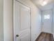 Bright entryway with white doors, a wooden floor, and a view of the front door welcoming guests at 861 Parc Townes Dr # 6, Wendell, NC 27591