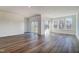 Large living room with hardwood floors, sliding glass doors to a balcony, and lots of natural light at 861 Parc Townes Dr # 6, Wendell, NC 27591