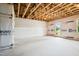 Partially finished basement with insulated walls and a door leading outside at 865 Parc Townes Dr # 4, Wendell, NC 27591