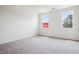 Spacious bedroom with carpet flooring and two windows offering ample natural light at 865 Parc Townes Dr # 4, Wendell, NC 27591