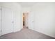 Comfortable bedroom with carpet, featuring a door that opens to a bathroom at 865 Parc Townes Dr # 4, Wendell, NC 27591
