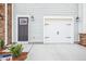 Two car garage with black hardware and stone accents at 865 Parc Townes Dr # 4, Wendell, NC 27591