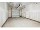 Spacious garage with a new garage door and smooth concrete flooring at 865 Parc Townes Dr # 4, Wendell, NC 27591