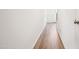 Hallway view of wood floors with doors leading to other rooms at 865 Parc Townes Dr # 4, Wendell, NC 27591