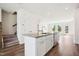 An open kitchen with granite countertops and stainless appliances with a view to the Gathering room at 865 Parc Townes Dr # 4, Wendell, NC 27591