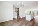Bright, open-concept living area flows into a modern kitchen with granite countertops and wood flooring at 865 Parc Townes Dr # 4, Wendell, NC 27591