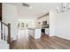 An open-concept living area flows into a modern kitchen, stairs, and out to the deck at 865 Parc Townes Dr # 4, Wendell, NC 27591
