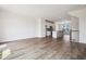 Bright living room features hardwood floors and an open floor plan leading to the kitchen area at 865 Parc Townes Dr # 4, Wendell, NC 27591