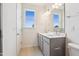 Elegant bathroom with double vanity, stylish fixtures, and ample natural light from two windows at 867 Parc Townes Dr # 3, Wendell, NC 27591