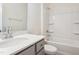 Clean and modern bathroom with a gray vanity, quartz countertop, and a shower and tub combination at 867 Parc Townes Dr # 3, Wendell, NC 27591