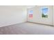 Bright bedroom with neutral carpet, two windows, and a SOLD sign indicating a successful sale at 867 Parc Townes Dr # 3, Wendell, NC 27591