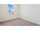 Light filled room features neutral carpet and white walls, offering a versatile space at 867 Parc Townes Dr # 3, Wendell, NC 27591