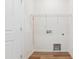 Laundry room complete with hookups and wire shelving for optimal storage and convenience at 867 Parc Townes Dr # 3, Wendell, NC 27591