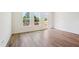 Bright and airy living space featuring hardwood floors, natural light, and access to the deck overlooking trees at 867 Parc Townes Dr # 3, Wendell, NC 27591