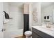 Modern bathroom with shower/tub combo, vanity, and dark gray cabinetry at 871 Parc Townes Dr # 1, Wendell, NC 27591