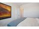 Bright bedroom with large artwork and comfy bed at 871 Parc Townes Dr # 1, Wendell, NC 27591