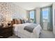 Spacious bedroom with accent wall and plenty of natural light at 871 Parc Townes Dr # 1, Wendell, NC 27591