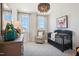 Charming Bedroom with a crib, armchair, and whimsical art at 871 Parc Townes Dr # 1, Wendell, NC 27591